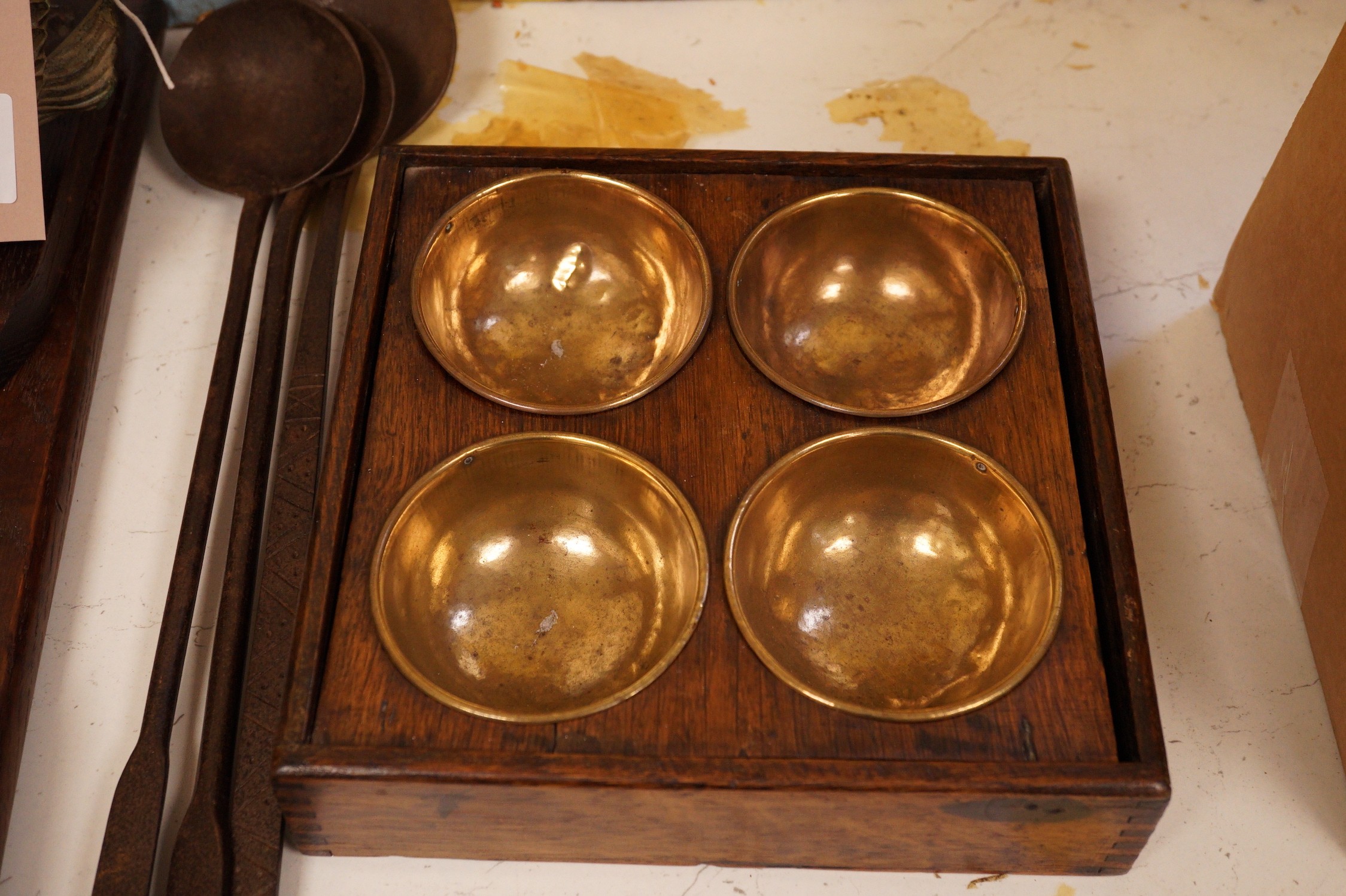 A carved oak book stand, brass spice box and others (6)